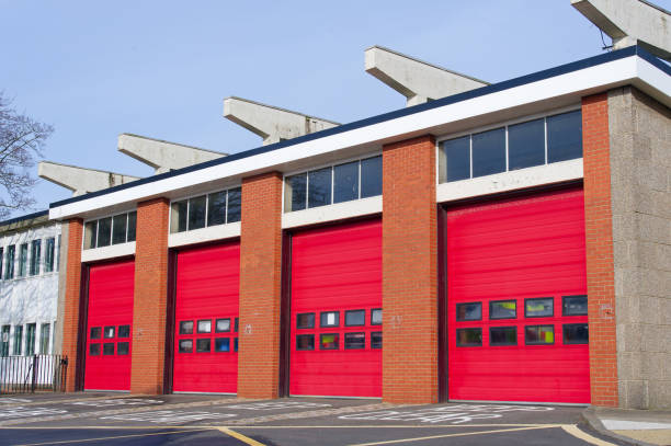 istock Fire brigade station building with red roller shutter doors 2126276102