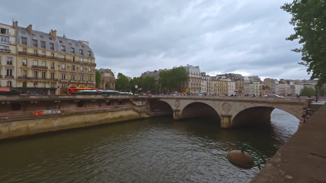 Cloudy day on St. Michaels Bridge in Paris overlooking the River Seine