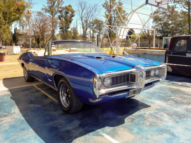 old blue sport 1969 pontiac gto convertible in a park. classic luxury muscle racing car. - pontiac gto imagens e fotografias de stock