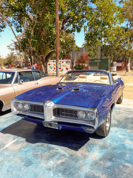 old blue sport 1969 pontiac gto convertible in a park. classic luxury muscle racing car. - pontiac gto stock-fotos und bilder