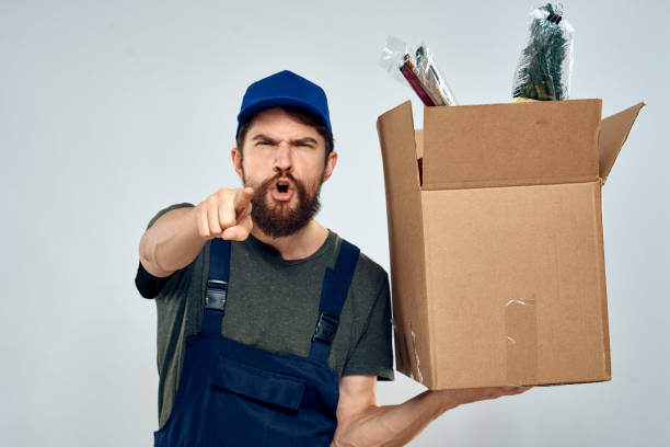istock Male worker loading delivery boxes in hands packing lifestyle 2126651839