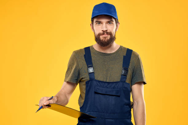 istock Worker man in uniform worker service yellow background emotion 2126652349