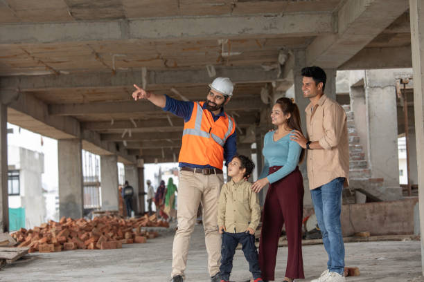 istock Architect and family looking away at construction site 2126659581