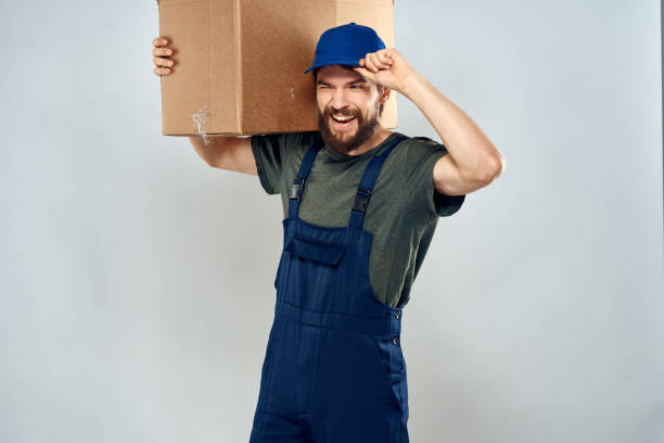 istock Male worker loading delivery boxes in hands packing lifestyle 2126668925
