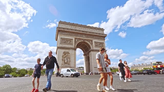 Majestic Arc de Triomphe under clear blue sky in Paris, France