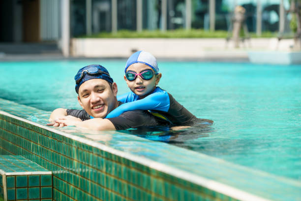 istock Little boy and father enjoy swimming. 2126675162