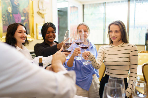 istock People enjoy drinking wine together. 2126675261
