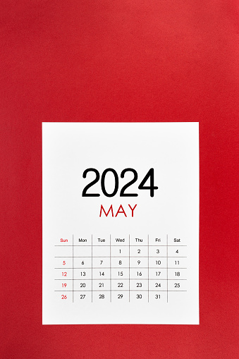 May 2024 calendar page on red color background.