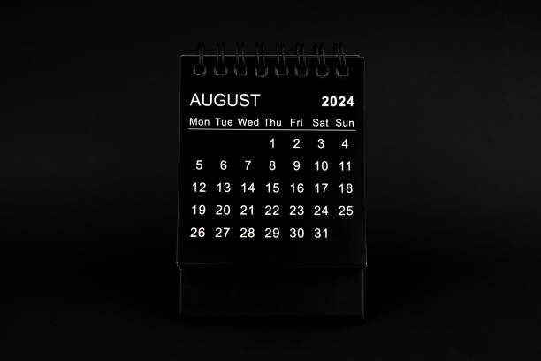 istock Black Calendar for August 2024. Desktop calendar on a black background. 2126756368