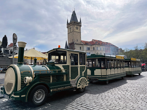 Prague, Czech Republic - March 27, 2024: Tourist train on Prague's famous square - Old Town Square.