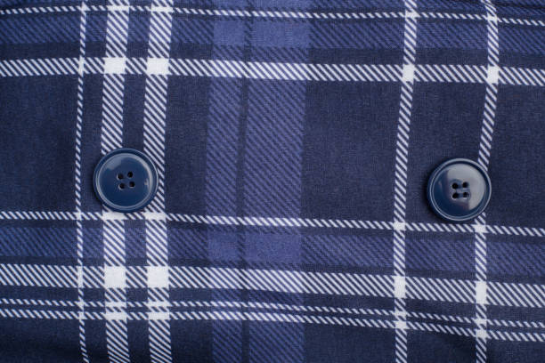 istock Fabric with blue and white crossed lines and buttons. Textile texture. 2126859102