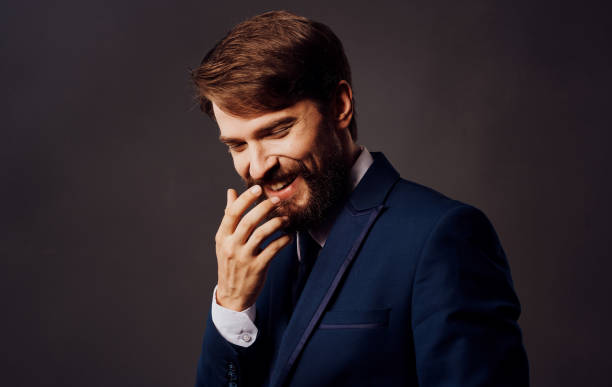 istock Bearded man in suit emotions gestures with hands close-up Studio 2126860649