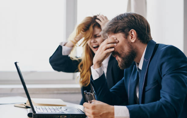 istock Man and woman working desk laptop technology office emotions communication 2126864767