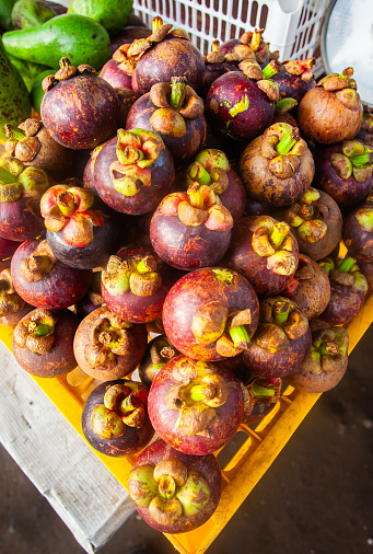 Mangosteen fruit, a purplish brown tropical fruit tastes sweet and refreshing.
