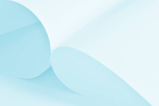 Large sheets of white paper with a soft, cool pastel image as the background.