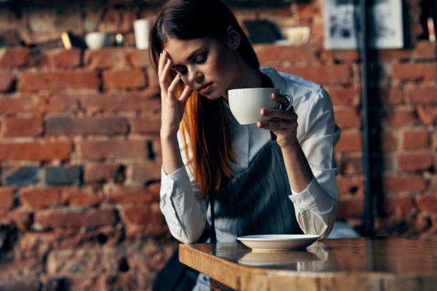 istock female waiter in apron coffee cup service ordering 2126964676