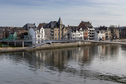 Namur, Belgium, 25 March 2024: View of the new footbridge: Passerelle l'Enjambée across the Meuse river in Namur. Completed in 2020 it connects the Grognon with Jambes.