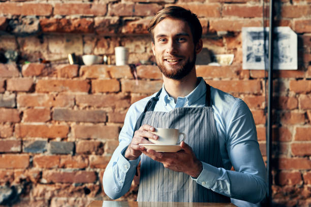 istock funny male waiter coffee cup restaurant service professional 2126984264