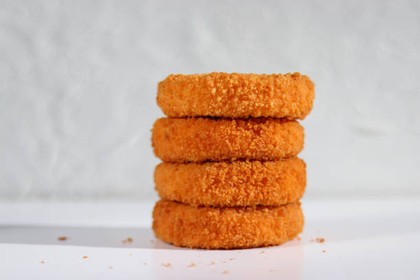 A stack of fried camembert on white backgroun