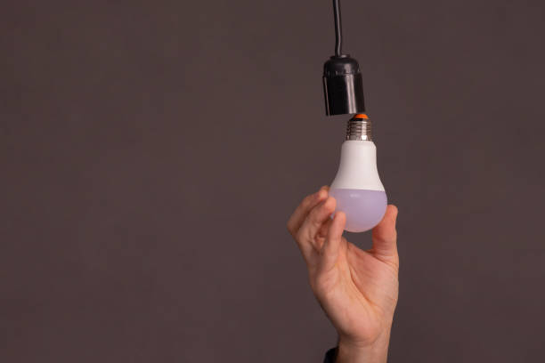 istock Replacement of an energy-efficient LED lamp. 2127036360
