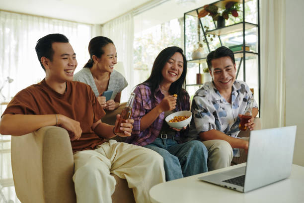 istock Friends Watching Comedy Show 2127044602