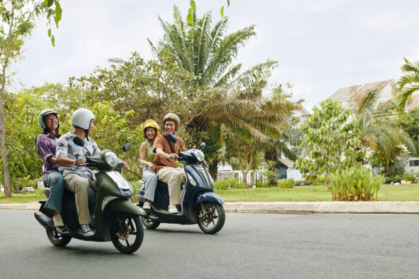 istock Vietnamese Couples Riding Motorbikes 2127044617