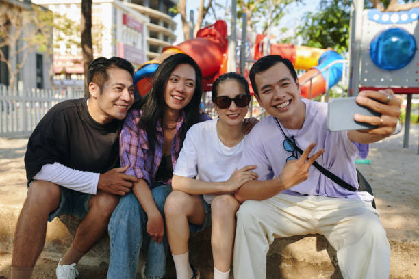 istock Friends Photographing Together 2127045116