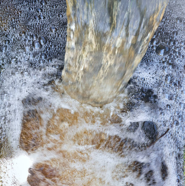 Waterfall of water polluted with chemical waste. stock photo