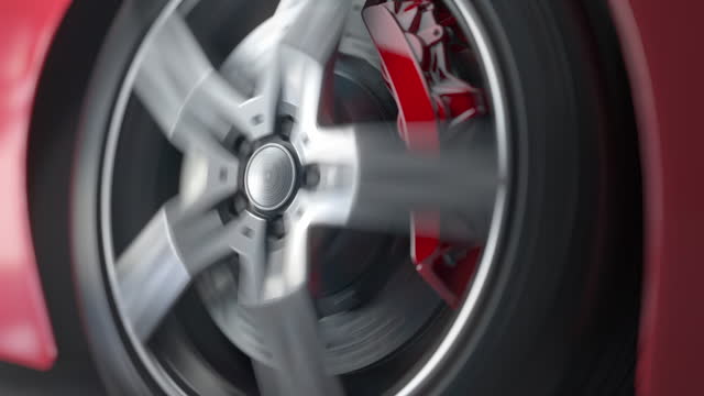 Car wheel on the road. Close up spinning sport car wheel. 3d video animation