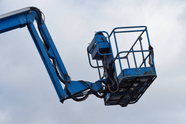 istock Extendable cherry picker with hydraulic arm and close up on cradle with safety rail 2127061605