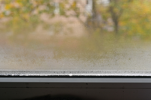condensation on the metal-plastic window. close-up