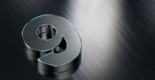 Metallic number nine on reflective stainless steel background