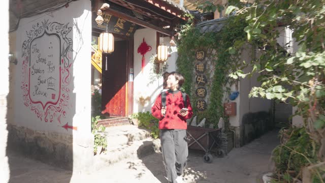 Woman visiting the Old Town of Lijiang,Yunnan,China.