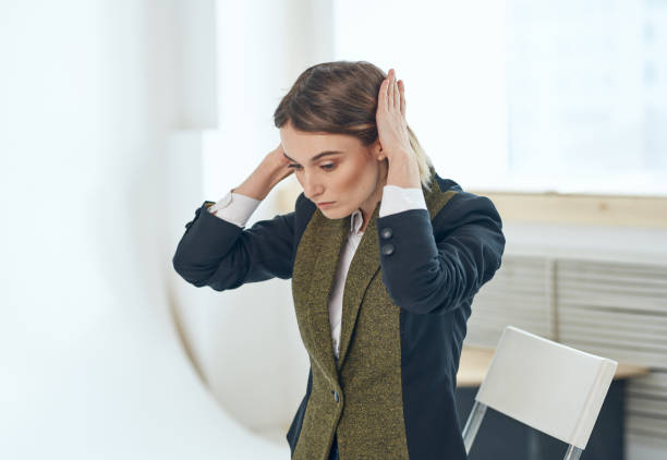 istock Woman in a jacket on a light background near the window model cropped view 2127132636