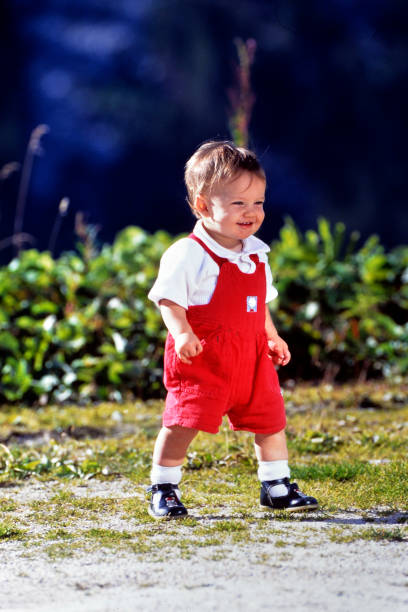 istock young smiling little boy walking in the garden 2127136210