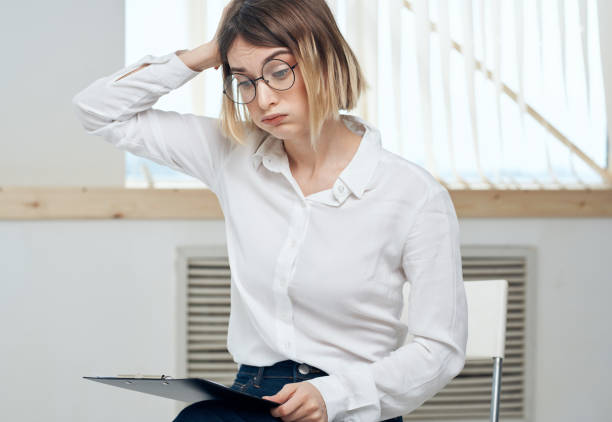 istock Business woman with a folder of documents in hands stress irritability emotions 2127145937