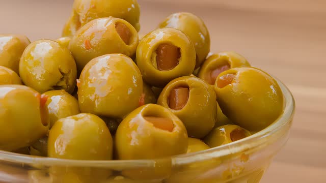 olives stuffed with paprika in a glass bowl