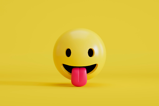 3d rendering of Emoji with stuck out tongue smiley face on yellow background.