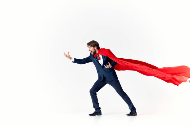 istock business man in a red cloak on a light background gesturing with his hands flying success advertising 2127182464
