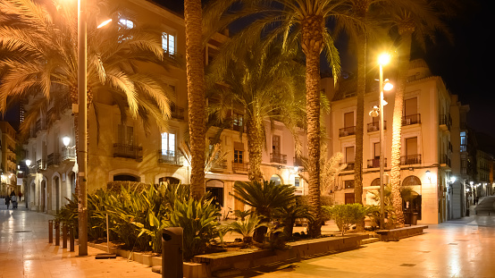 Late night view of deserted street in old town Alicante, Spain.