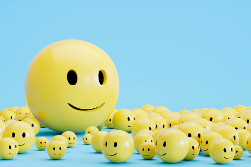 3d rendering of Emoji with smiley face on blue background.