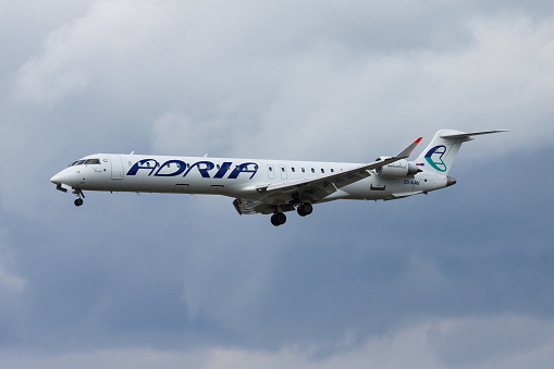 Frankfurt, Germany - August 17, 2014: Adria Airways passenger plane at airport. Schedule flight travel. Aviation and aircraft. Air transport. Global international transportation. Fly and flying.