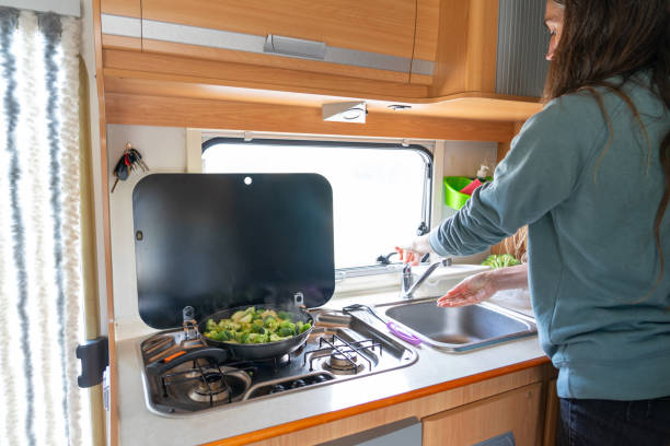 istock Woman cooking in a motorhome 2127292351