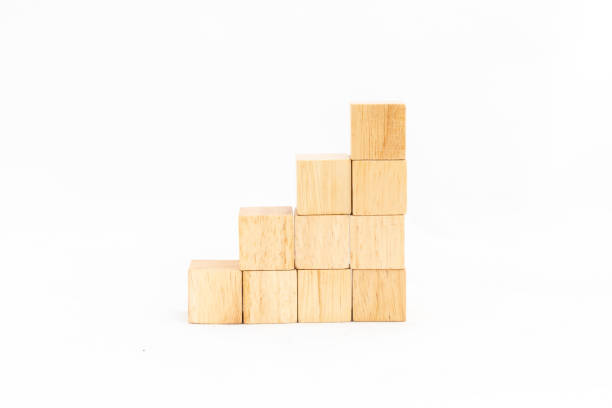 istock Blank wooden cubes stairs isolated on a white background with copy space. 2127358128