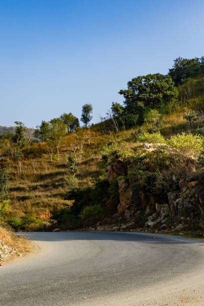 istock isolated twisted mountain tarmac road at afternoon from flat angle 2127373758