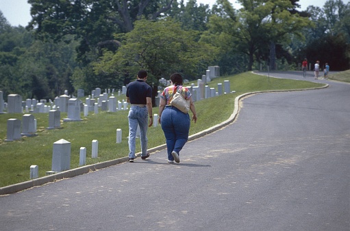 Washington DC, USA, 1985. Visitors at a cemetery in Washington DC.