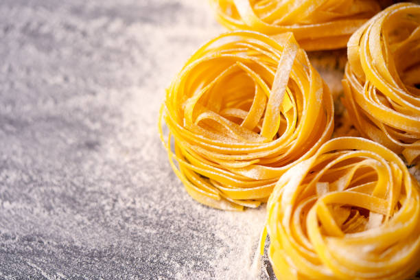 istock Italian Pasta tagliatelle on dark background 2127438908