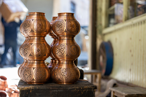 Nested copper items, Historical Coppersmith Bazaar at Gaziantep city, Crafting copper goods by artisans in the bazaar
