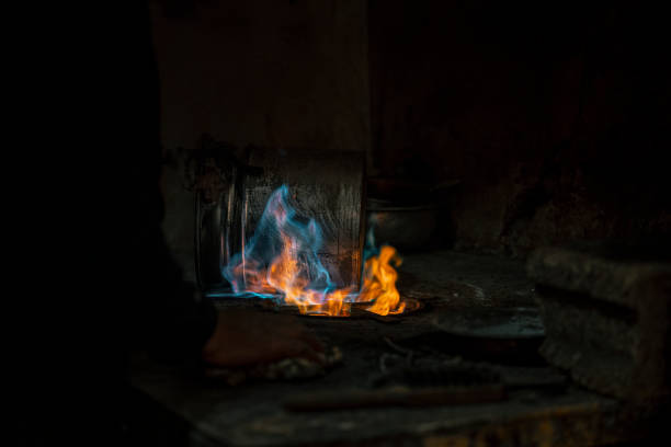 Kitchen gas stove, burner with blue flame.