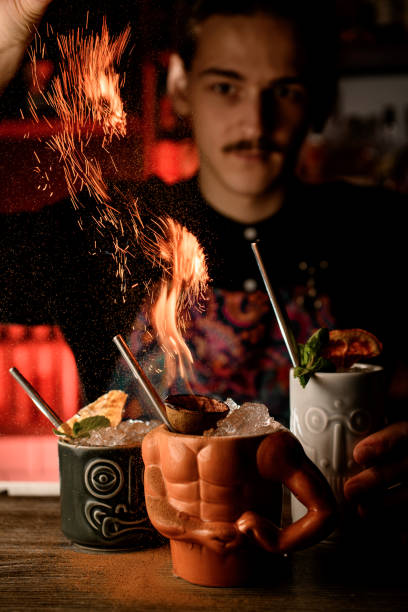 istock There are three shaped cups with ice on the bar counter, one of which has a fire 2127462099